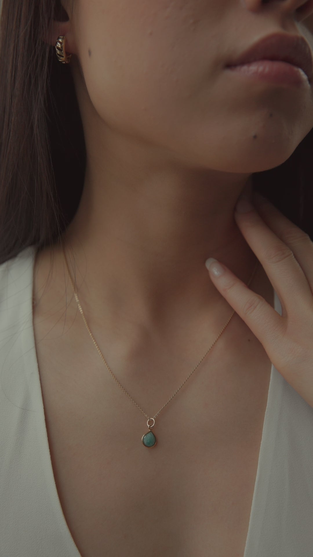 Stunning Amazonite Briolette Cut Necklace Video - Watch the beauty and sophistication of this unique jewelry piece come to life. Delicate gold chain and briolette cut gemstone in pastel green hue. Perfect for adding elegance to your style.