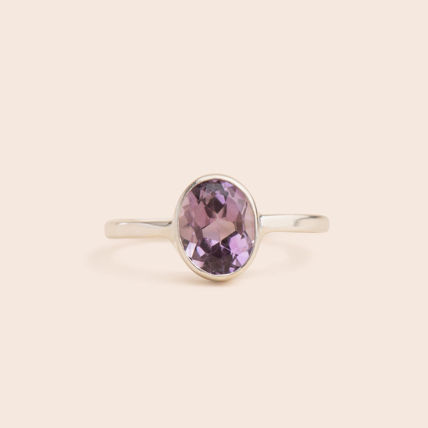 "Shop the stunning amethyst oval sterling silver ring at [company name]. Add a touch of sophistication to your look with this elegant and affordable jewelry piece."