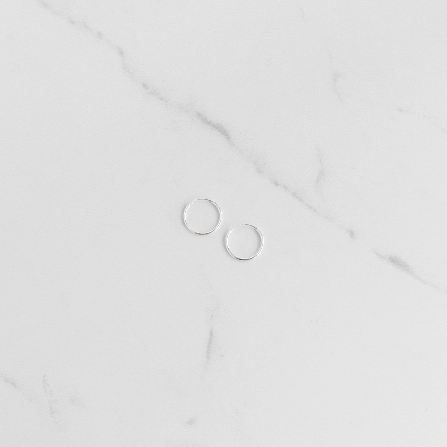 Load image into Gallery viewer, Small Silver Sleeper Hoop Earrings - Gemlet
